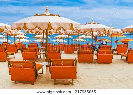 Beach chairs and umbrella on the Fetovaia beach in Elba island Tuscany Italy.