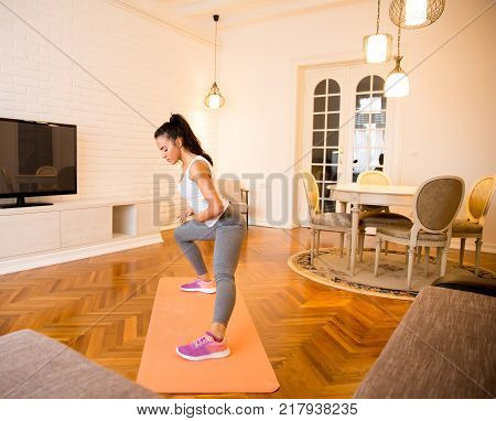 Fit Young Woman Exsercise In The Room