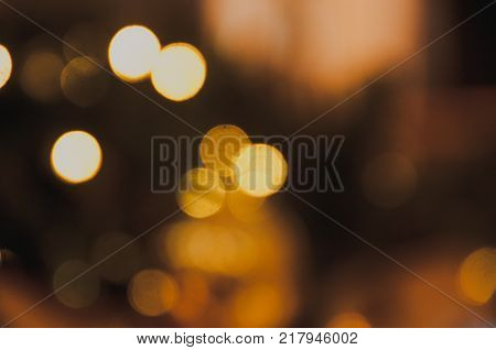 Beautiful gold blur bokeh lights defocused abstract background.Light abstract bokeh shine or colorful glitter effect background.