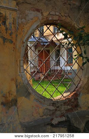 A view of the city wall with a round opening in the ancient Russian town of Yelets.