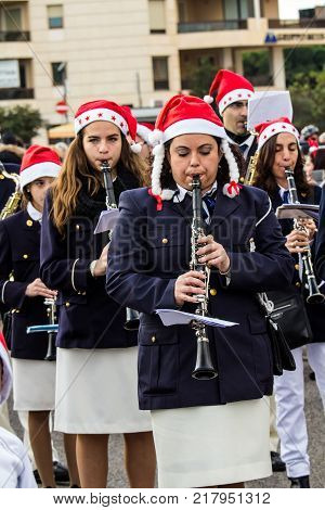 CAGLIARI, ITALY - DECEMBER 8, 2017: Village and parade of Santa Claus, viale Bonaria - Sardinia (Band of Monastir)