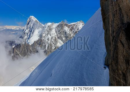 Mont Blanc mountain view from Aiguille du Midi. France. In background Grands Jorasses mountain.