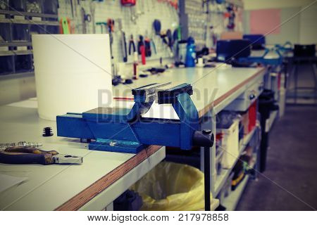Workbench In A Mechanical Workshop For Repairs With Vintage Effe