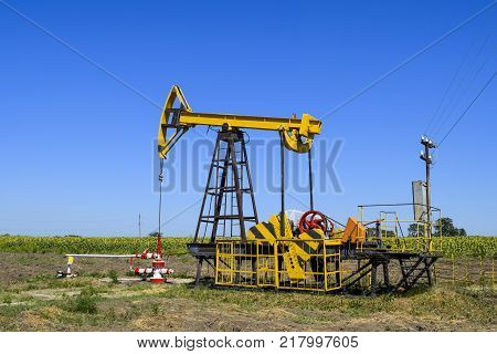 The Pumping Unit As The Oil Pump Installed On A Well. Equipment Of Oil Fields.