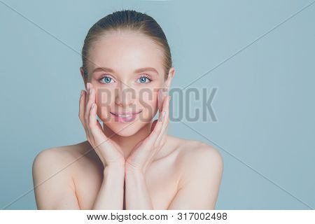 Portrait Of Beautiful Woman With Natural Make Up Touching Her Face.
