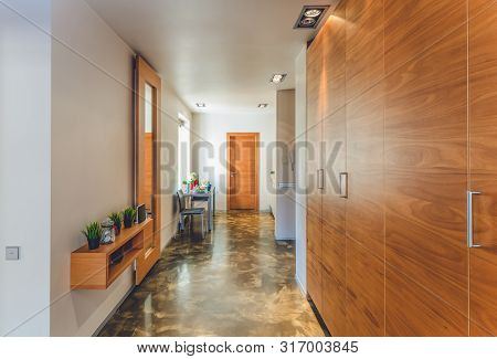 Wardrobe In The Hall. Served Table. Shalf With Decorative Elements.