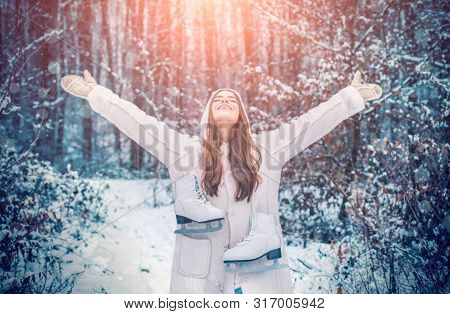 Winter Girl In Snow. Beauty Winter Girl In Frosty Winter Park. Outdoor Close Up Portrait Of Young Be