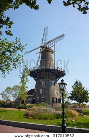 Leiden, Holland - July 26, 2019: Historical tower mill de Valk, the Falcon, and museum 