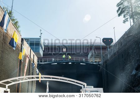 Lappeenranta, Finland - August 7, 2019: Lock And Bridge On The Saimaa Canal At Malkia. Engineers Are