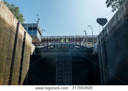 Lappeenranta, Finland - August 7, 2019: Lock And Bridge On The Saimaa Canal At Malkia. Engineers Are