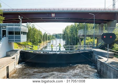 Lappeenranta, Finland - August 7, 2019: Lock And Bridge On The Saimaa Canal At Malkia. Engineers Are