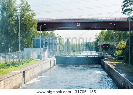 Lappeenranta, Finland - August 7, 2019: Lock And Bridge On The Saimaa Canal At Malkia. Engineers Are