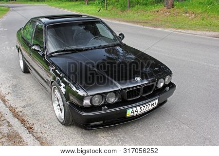 Kiev, Ukraine. May 17, 2014. Bmw M5 (e34) Against The Background Of The Forest.