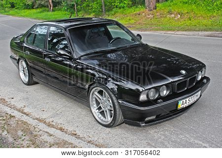 Kiev, Ukraine. May 17, 2014. Bmw M5 (e34) Against The Background Of The Forest. On The Bmw Wheels Sc