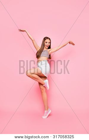 Full Length Photo Of Charming Lady Raisin Her Hands Lergs Wearing Grey Tank-top White Denims Jeans S