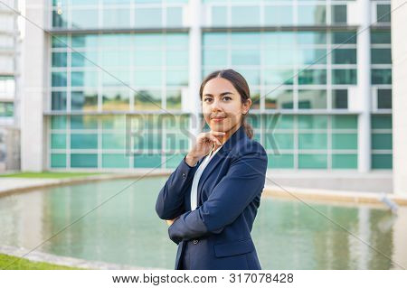 Satisfied Successful Business Leader Posing Outside. Beautiful Latin Woman Wearing Formal Suit, Stan