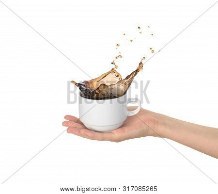 White Cup With Coffee Splas  In The Womens Hand Isolated