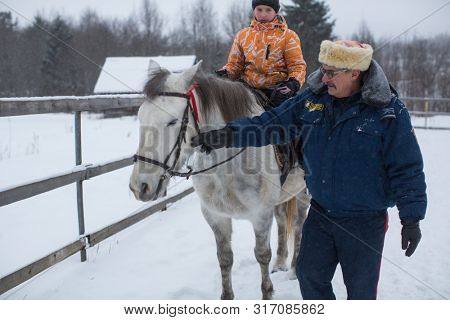 PODPOROZHYE, RUSSIA - JAN 21, 2018: Training of children riding in the framework of revival program of the Cossacks in the Leningrad region. Cossacks in St.Petersburg began its revival in 1990.