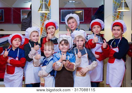 Alchevsk, Ukraine - March 24, 2019: School Cook For Children. Children Posing