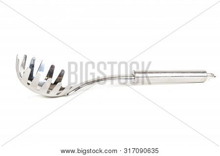 A Metal Pasta Server Isolated On A White Background