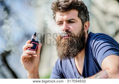 Man With Beard Breathe Out Smoke. Clouds Of Flavored Smoke. Bearded Man Smoking Vape. Smoking Electr