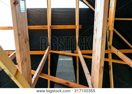 Roof Trusses Covered With A Membrane On A Detached House Under Construction, Visible Roof Elements, 