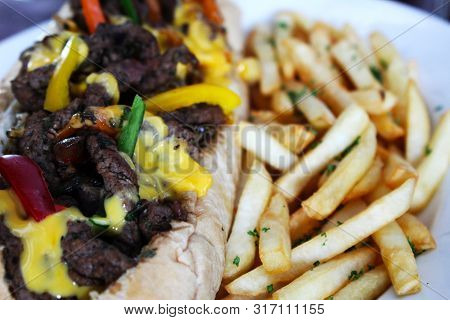 Sandwich With Pork Accompanied With French Fries