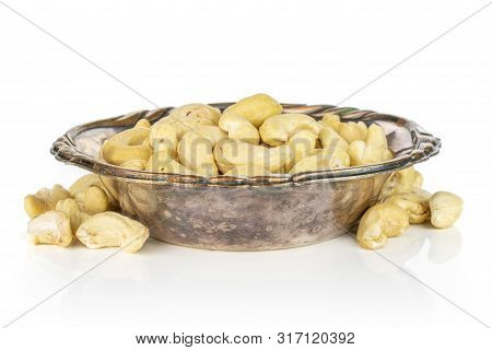 Lot Of Whole Unsalted Beige Cashew In Metal Bowl Isolated On White Background