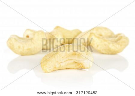 Group Of Six Whole Unsalted Beige Cashew Isolated On White Background