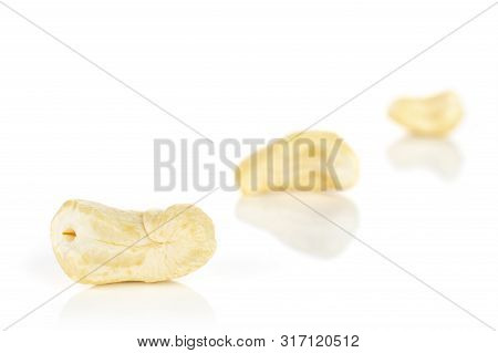 Group Of Three Whole Unsalted Beige Cashew Isolated On White Background