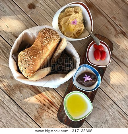 Soft Fresh Wheat Bread Lies In Rag Bag Next To Thick Bee Honey In Bowl. Beautiful Composition Consis