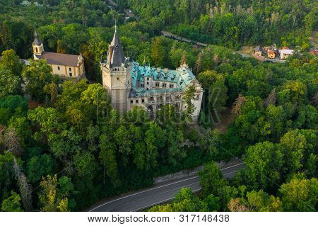 Aerial View Of Old Castle In Green Wood