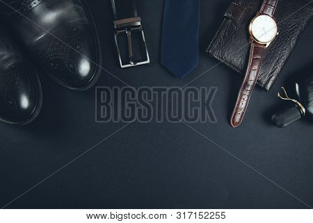 Man Different Accessorise  On The Dark  Table