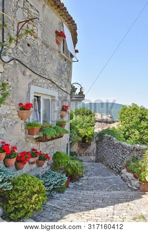 Narrow Street Between The Houses Of An Italian Medieval Village