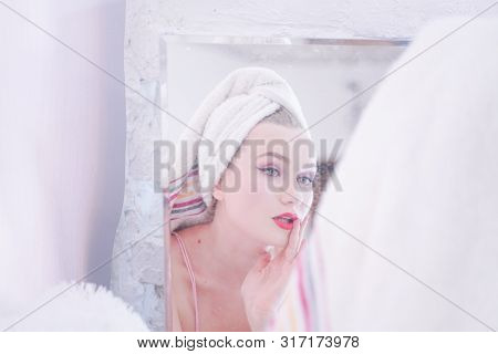 Attractive Young Woman Wrapped With Bath Towel After A Shower At The Bathroom.