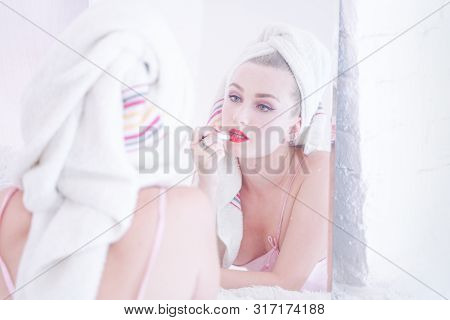 Attractive Young Woman Wrapped With Bath Towel After A Shower At The Bathroom.