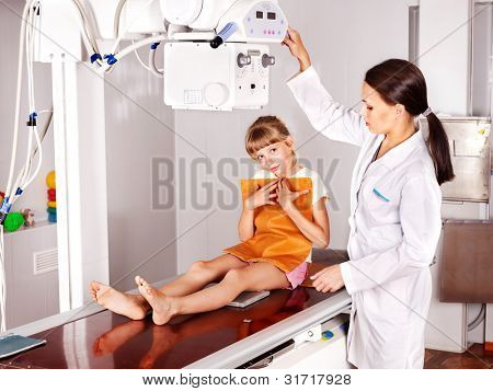 Little girl with doctor radiologist.
