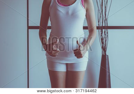 Women Hands Showing Thumb Up With Leucorrhoea And Pain In Abdomen Or Discharge With Foul Smell,home 