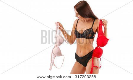 Red And Beige Bra In Brunette Woman Hands, Isolated On White.
