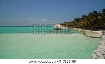 Beautiful Beach, Palm Trees By Turquoise Water. Onok Island, Balabac, Philippines. Summer And Travel