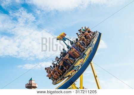Kouvola, Finland - 10 August 2019: Ride Trombi In Motion On Sky Background In Amusement Park Tykkima