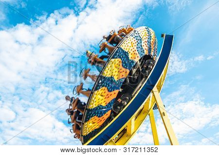 Kouvola, Finland - 10 August 2019: Ride Trombi In Motion On Sky Background In Amusement Park Tykkima
