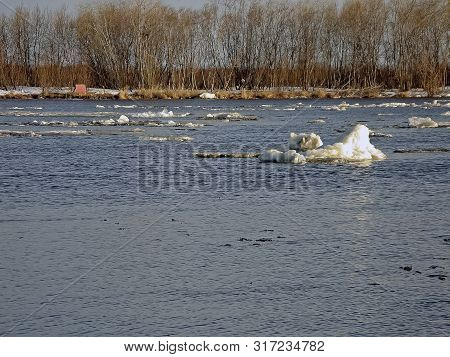 Melting Snow In The Spring. The Spring Heat Will Melt The Snow. Brooks And Streams Of Melt Water
