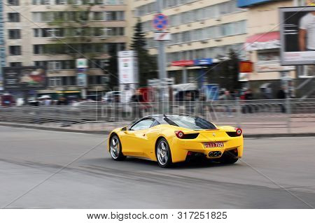 Ukraine, Kiev. June 25, 2013. Yellow Ferrari 458 Italia. Car In Motion