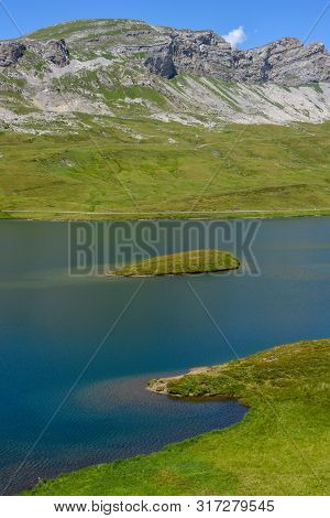 View At Lake Tannensee Over Engelberg In The Swiss Alps