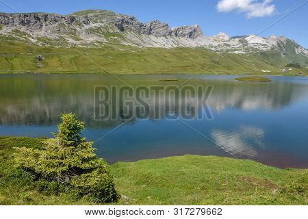 View At Lake Tannensee Over Engelberg In The Swiss Alps