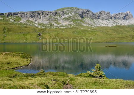 View At Lake Tannensee Over Engelberg In The Swiss Alps