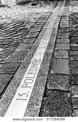 15th Meridian Line In Cobbled Street Of Jindrichuv Hradec, Czech Republic. Inscription 15. Polednik 