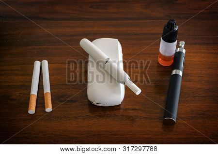 Smoke And Steam Systems In Comparison, Normal Cigarette, Tobacco Heater With Sticks And E-cigarette 