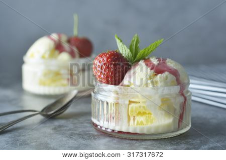 Delicious Vanilla Ice Cream With Mint Leaves And Strawberries, Sweet Dessert.